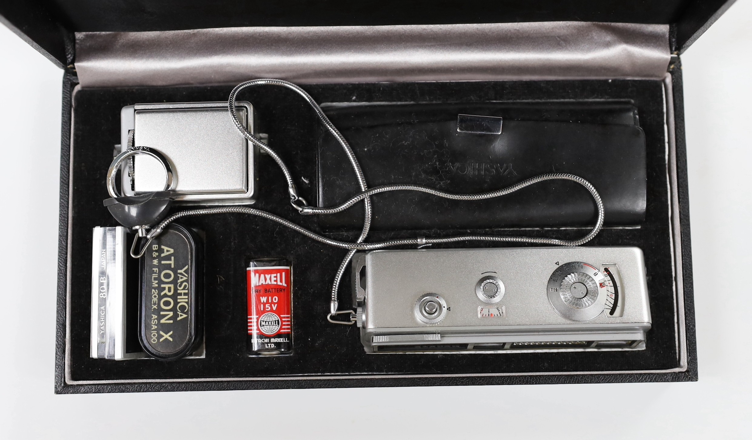 A Yashica Atoran miniature camera, with accessories in original packaging